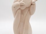 figurine of a man in a hat and robe holding a baseball bat