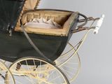 a baby carriage that is sitting on the floor