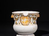 an image of a white and gold vase sitting on top of a table