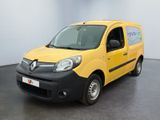 une camionnette jaune et noire garée dans une pièce blanche au sol noir
