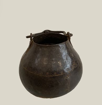 a black pot that is sitting on a table