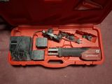a tool in a case that is sitting on the floor