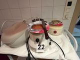 a table with a pot of soup and a bowl of soup on it