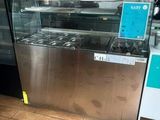 an image of a restaurant kitchen with a counter and oven