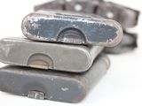 three old cell phones stacked on top of each other