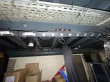 a ceiling that has a bunch of lights hanging from it