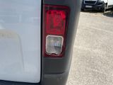 a close up of the tail light of a white truck
