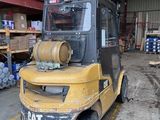a yellow forklift truck parked in a warehouse