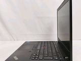 a black laptop computer sitting on a white surface