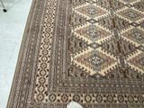 a large rug on the floor with a chair in the background