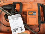 an orange box with a hammer and other tools in it