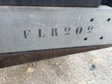 a close up of a metal sign on the back of a truck