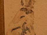 a drawing of a dog on the wall next to a person ' s feet