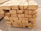 several pieces of wood stacked on top of each other in a pile