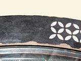 a close up of a tire with a flower design on it