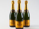 three bottles of champagne on a white background