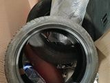 a box with a tire inside of it and a plastic bag