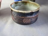 three bowls that are sitting on a table next to each other