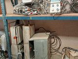 a lot of wires and wires on a shelf in a room