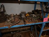 many tools on a shelf in a garage