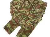 a close up of a camouflage suit on a white surface