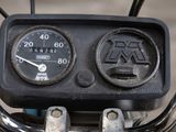 a close up of a motorcycle ' s speedometer and gauge