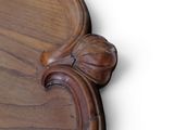 a close up of a wooden table with a flower on it