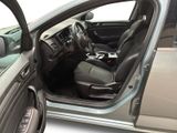 the interior of a car with the door open and the driver ' s seat down