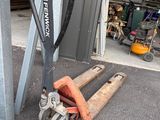 an image of a fork truck and a pallet in a garage