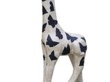 statue of a giraffe on a black base with a white background