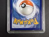 a pokemon card in a plastic holder on a table