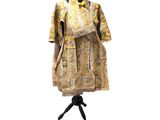 an image of a dress on a mannequin stand with a white background
