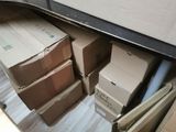 several boxes are stacked on top of each other in a room