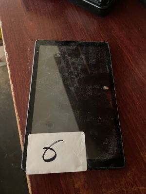 a tablet computer sitting on a table with a number 6 on it