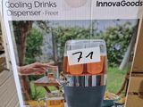 packaging of a beverage dispenser sitting on top of a cardboard box