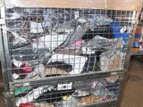 a metal cart with many items in it in a warehouse