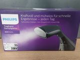 emballage d'un sèche-cheveux Philips posé sur une table