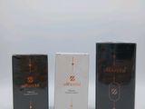 three boxes of different types of perfume sitting next to each other