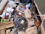 a cardboard box filled with assorted items on the floor