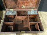 a wooden box that has four compartments inside of it