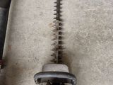 two chainsaws that are laying on the ground