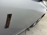 a sticker on the hood of a car with a clock on it