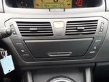 a close up of a car dashboard with a clock on it