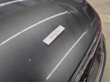 a close up of a car ' s hood with a sticker on it
