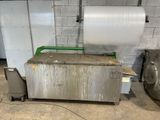 a machine that has a roll of paper on top of it
