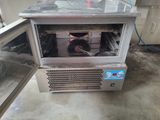 a small oven that is sitting inside of a building