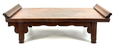 a small wooden table with a bench on top of it