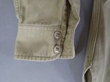 a close up of a pair of pants with buttons on them