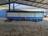 a truck that is parked under a roof
