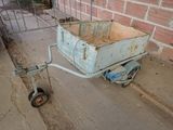 a small cart that is sitting on the side of the street